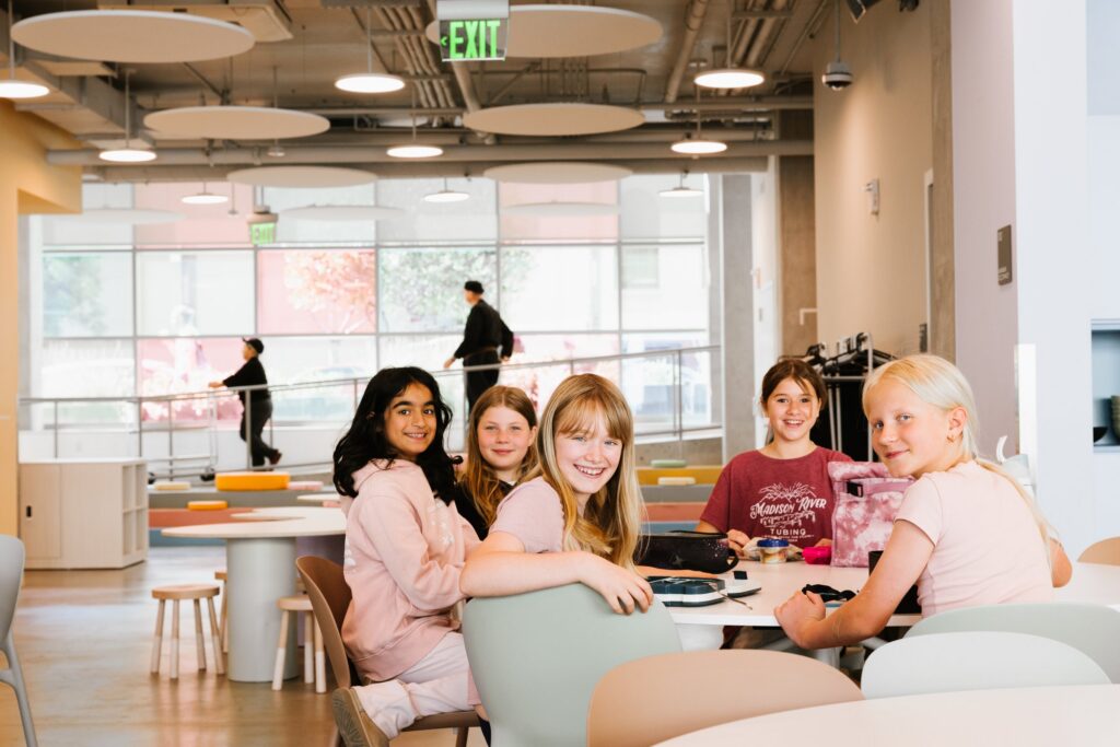 Students smiling in a La Scuola classroom
