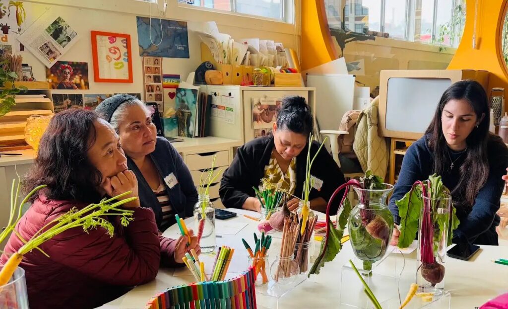 Educators arranging vegetables at a workshop table